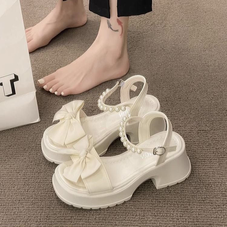 Thick-soled pearl sandals women's  new summer bowknot fairy wind one-word fashion open-toed Roman women's shoes