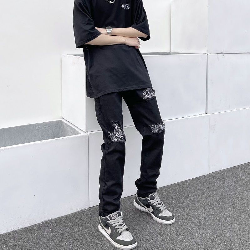 高街破洞貼布腰果花牛仔褲男美式潮牌復古百搭黑色修身小腳長褲子