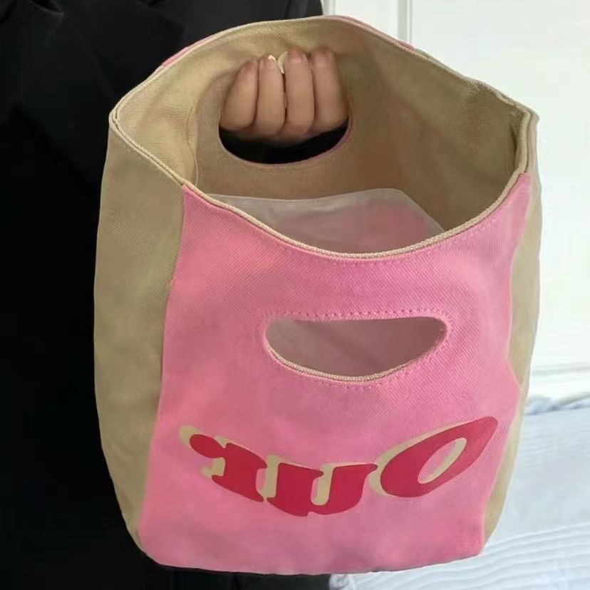 小眾設計可愛手拿包托特包休閒通勤飯盒包粉色化妝包手提收納包女