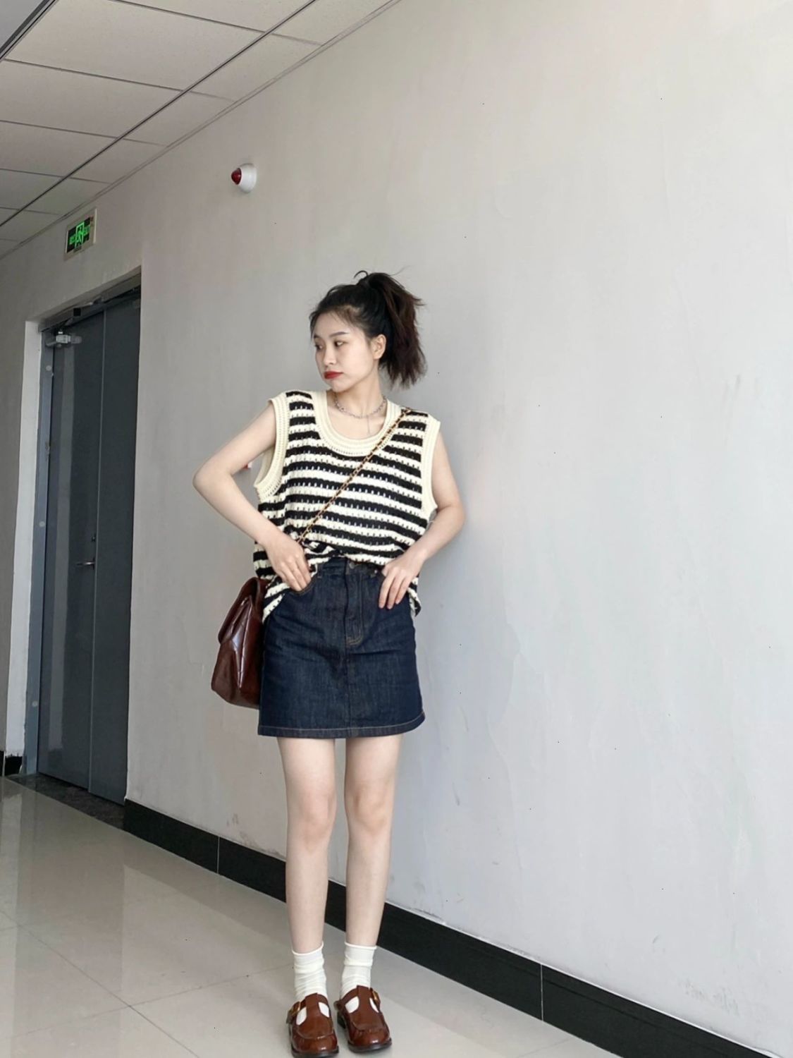 Two-piece suit/one-piece Korean casual sleeveless vest vest hollowed out knit top + denim skirt trendy