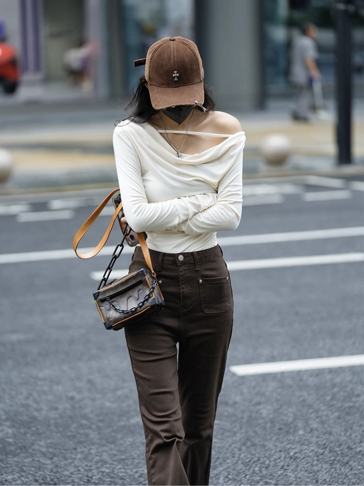 Solid color long-sleeved irregular T-shirt for women in autumn, new design, niche, slim, unique, unique and beautiful.