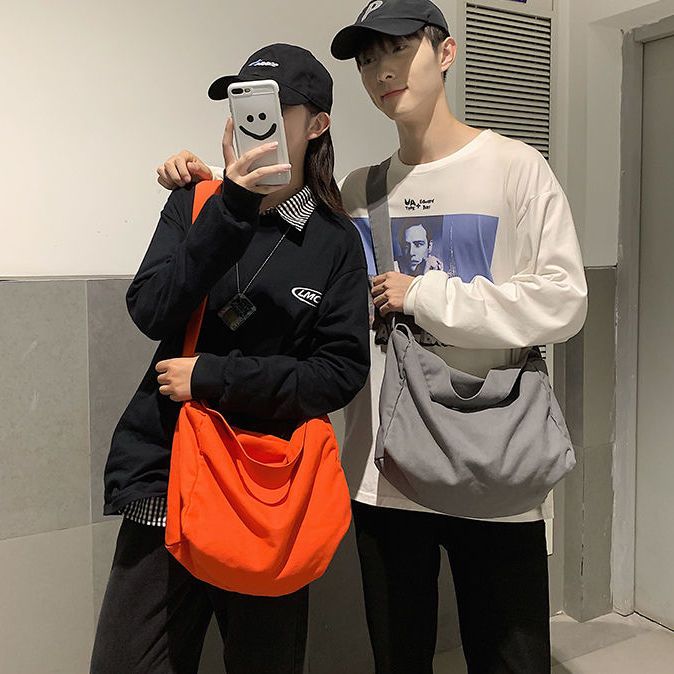 Korean original light canvas bag fashionable cool versatile large capacity male and female student messenger bag couple shoulder bag