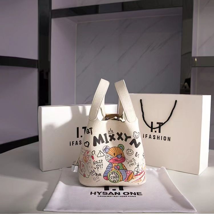 奧特萊斯正品撤櫃原皮塗鴉菜籃子女包2022新款時尚小眾水桶手提包