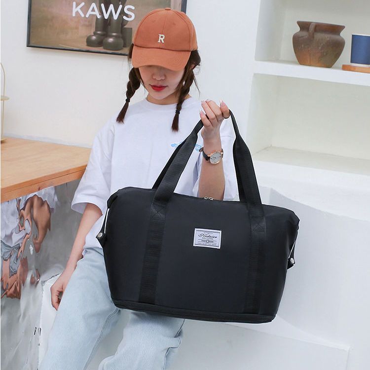 Large-capacity travel bag women's short-distance luggage bag large-capacity portable travel bag lightweight waterproof ready-to-birth bag storage bag